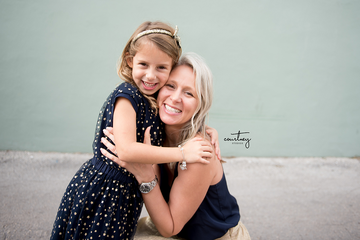 mother daughter loving hugging portrait miami family photographer